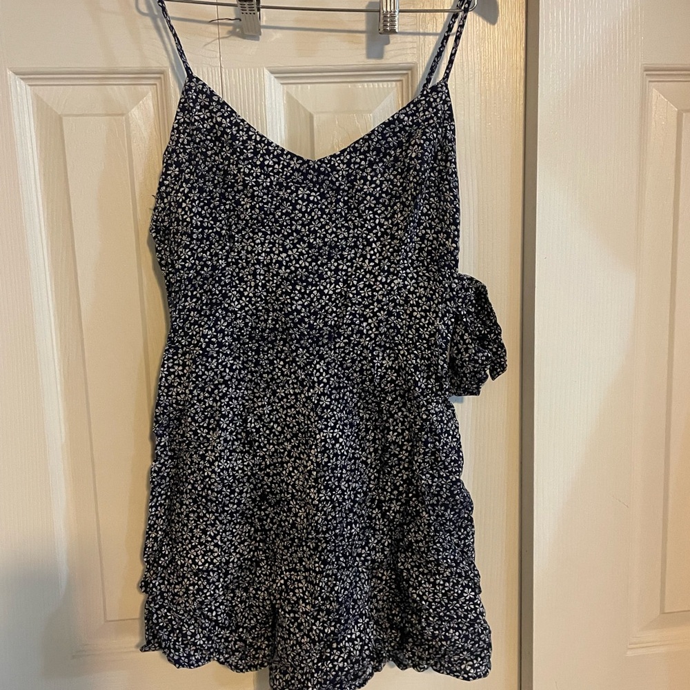 Arizona Woman’s romper. Size small. Blue and white flowers. Brand new.